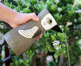 Designed by Artist Michelle Allen, this vessel can be used as a vase or as a watering can, making it the perfect gift for any plant enthusiast!