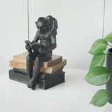 Add some style to your bookshelf or mantle with these curious characters from White Moose!