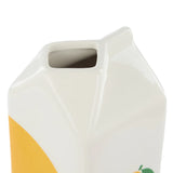This lemon juice vase is crafted from ceramic in the shape of a juice carton with a fun lemon print